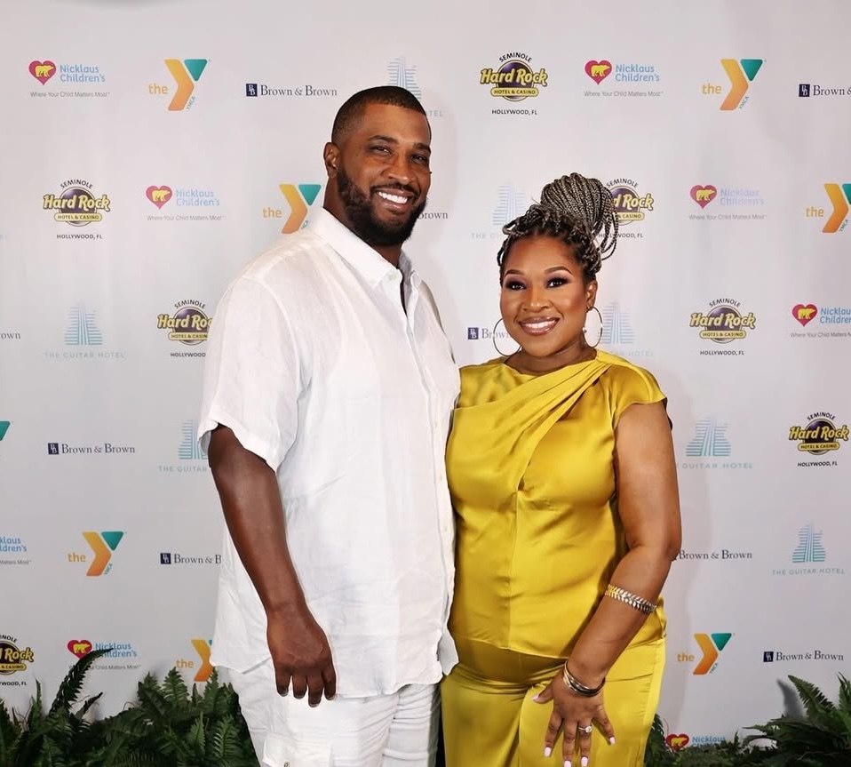 Daunte and Kimberly Culpepper standing together at a community event