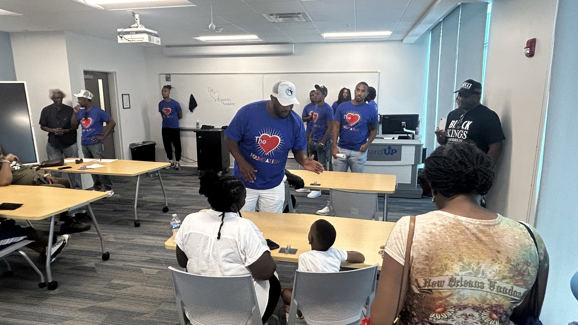 Experience Foundation volunteers engaging families at a Back to School community event