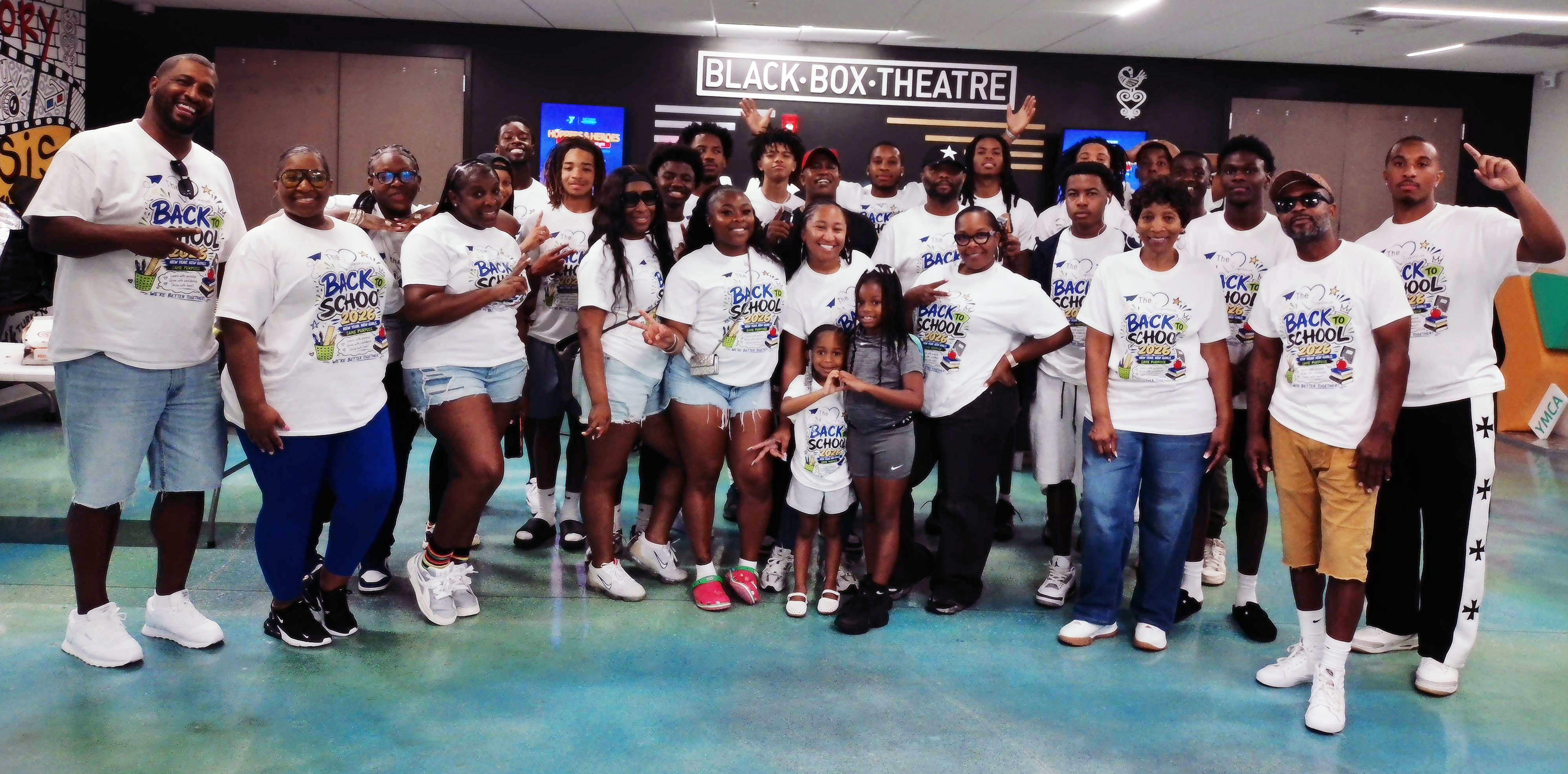 Experience Foundation volunteers and community members gathered at a Back to School event